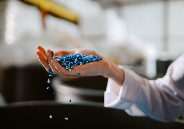 Hand inspecting plastic pellets