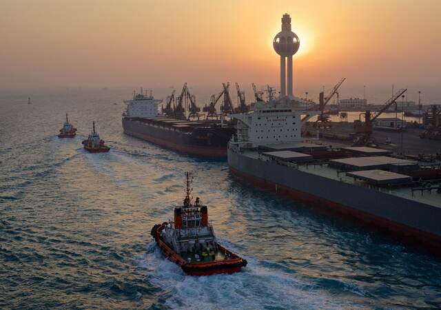 Tugs and freighter boats moored along the wharf in Saudi Arabia