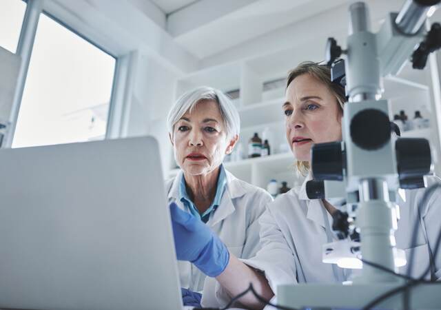 Scientists in chemistry laboratory