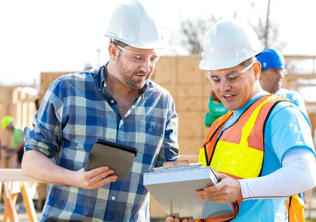 Construction managers discuss building plans