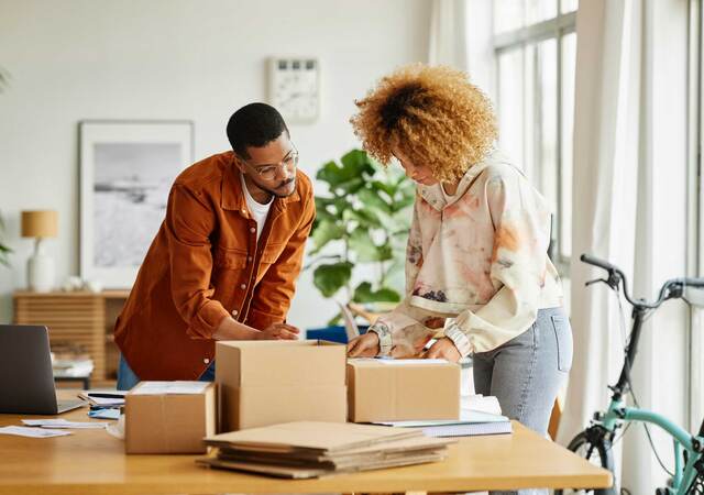 Two entrepreneurs packaging products