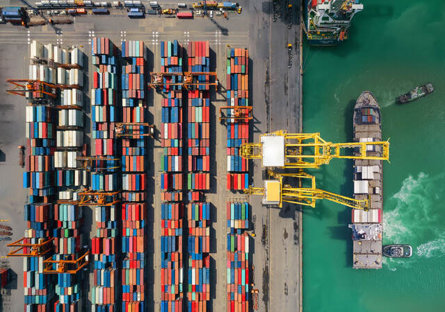 Shipping containers being loaded on a ship