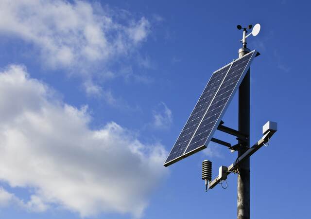 Photovoltaic streetlights gathering solar power during the day.