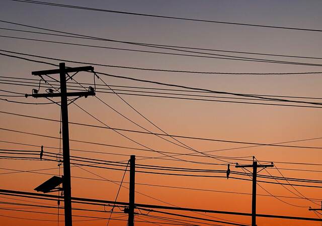 Electric poles at sunset.