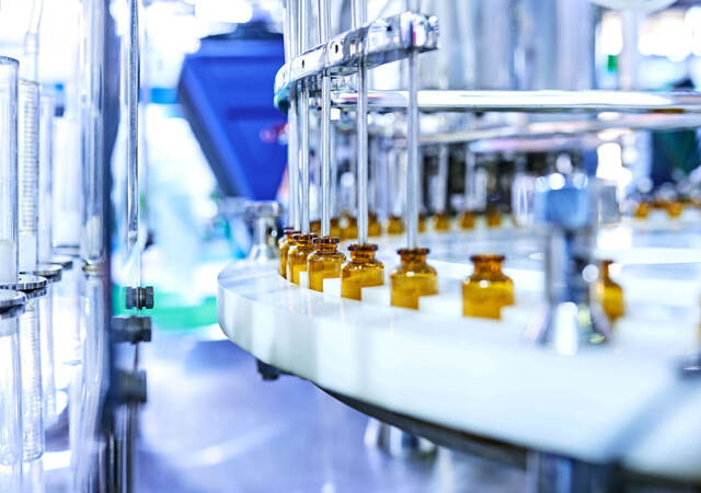 Glass medicine bottles on a factory line