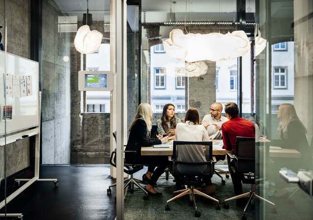 People having a meeting in a conference room