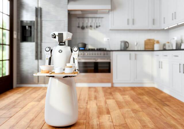 Serving robot holding tray in a kitchen.