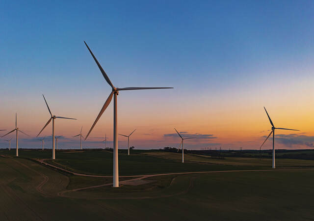 Drone view of a wind farm. Multiple wind turbines