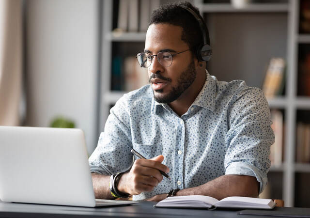 Focused business person watching webinar