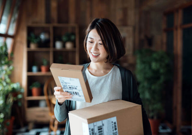 Woman holding two packages