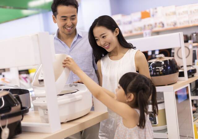 Family shopping in a consumer electronics store.