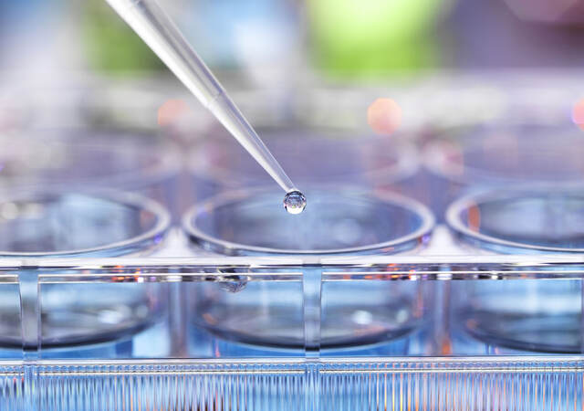 Pipetting sample into multiwell plate for analysis in a laboratory