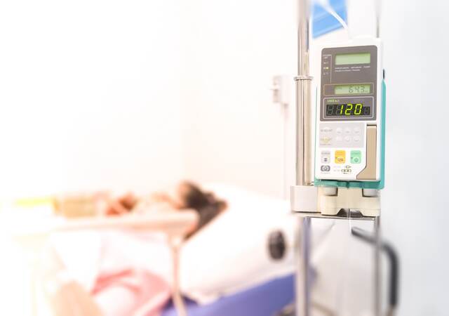 Infusion pump feeding IV drip into patients.