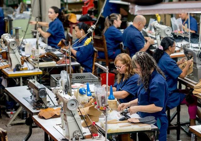 Manual workers working at a factory.