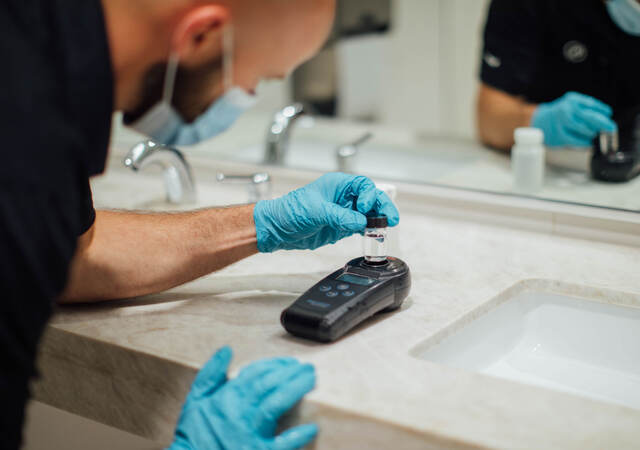 A person testing air and water quality