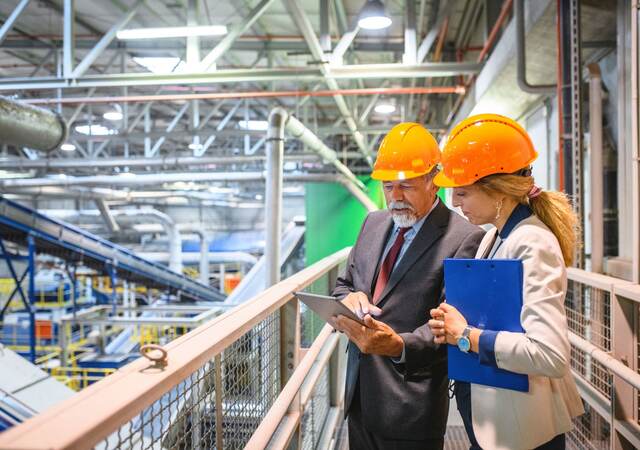 Manager and quality controller inside recycling facility.