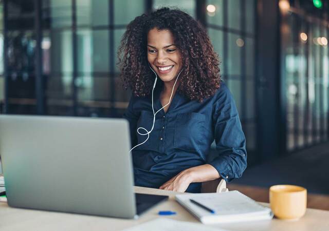 Person smiling while having an online meeting