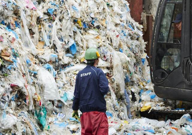 Workers at an industrial waste treatment facility.