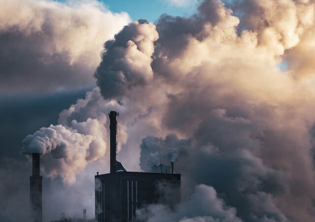 Emissions rising from smoke stacks