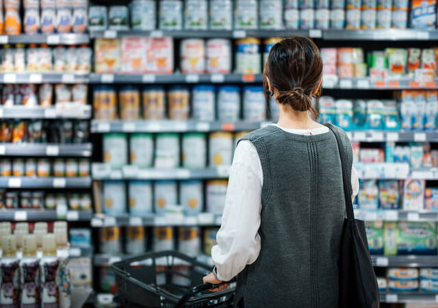 Person looking at shelves of products in a grocery store