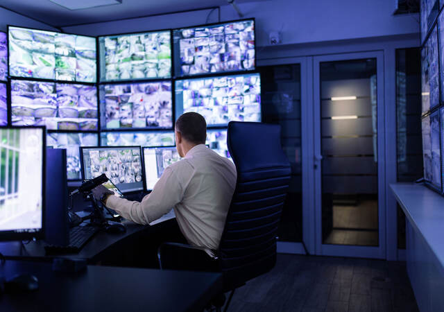 A person working in a surveillance room