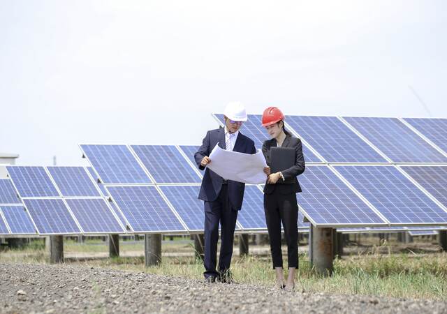 Engineers at photovoltaic power station.