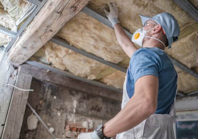 Replacing old attic mineral wool insulation.