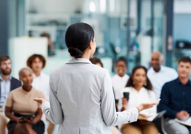 Businesswoman giving a presentation in the office boardroom.