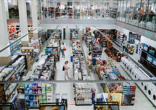 Overhead view of many people shopping in a large supermarket