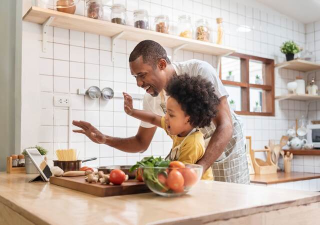 Father and son cooking.