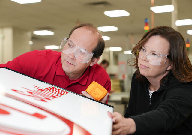 Two UL Solutions employees working together