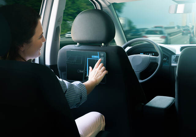 A passenger in an autonomous taxi