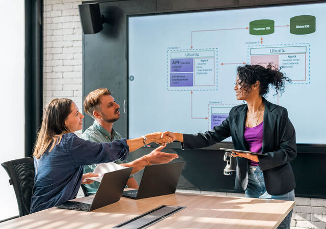 People shaking hands during a meeting