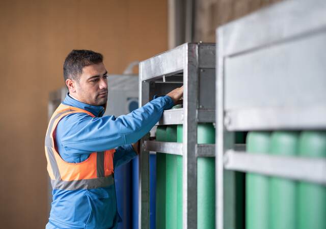 Engineer checking gas cylinders