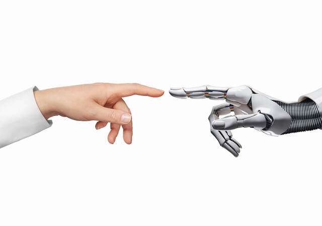 AI and human hand touching index fingers