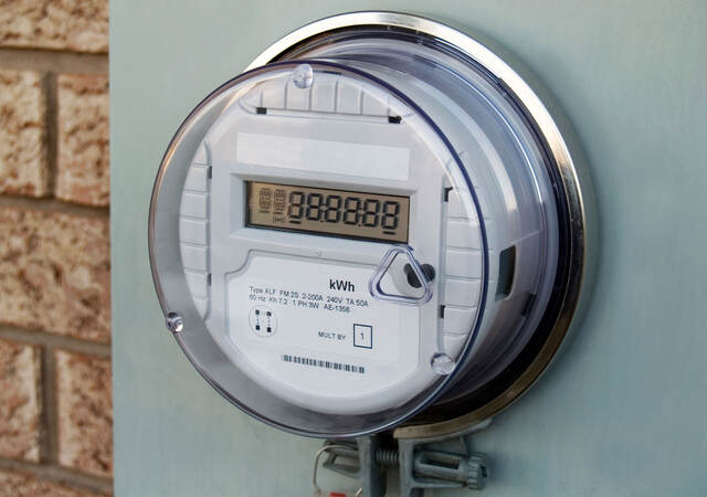 A smart meter on the exterior of a house