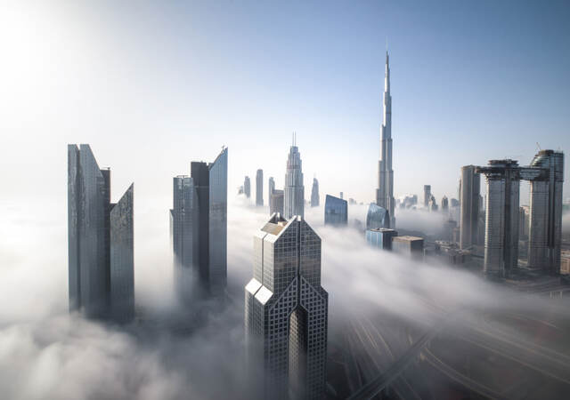 Dubai Downtown skyline on a foggy winter day.