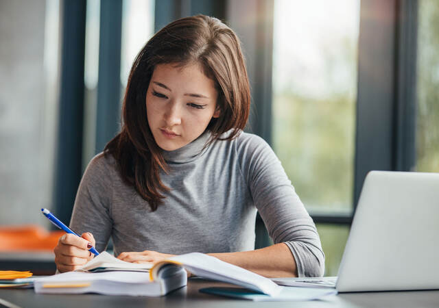 A person taking notes