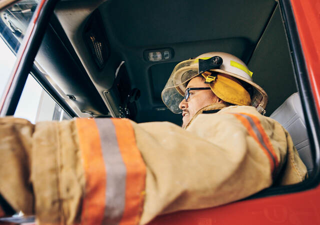 A firefighter in a fire truck