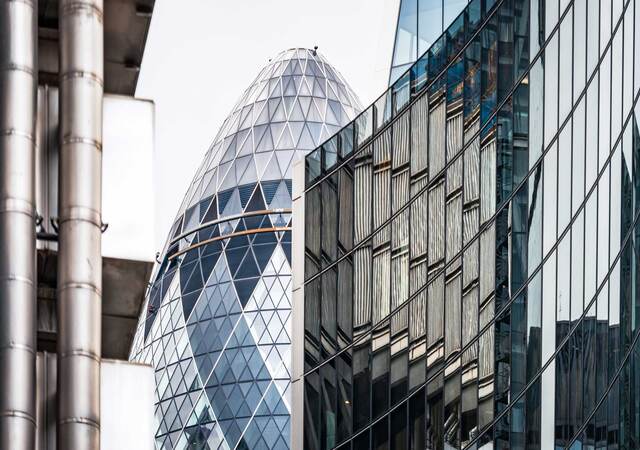 Modern office buildings at the centre of the City of London, including Lloyds of London and the Sir Norman Foster Building.