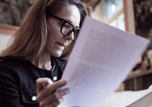 Person analyzing documents