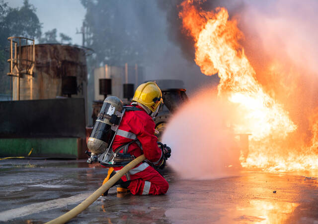 Firefighters Extinguishing Blaze in Industrial Area