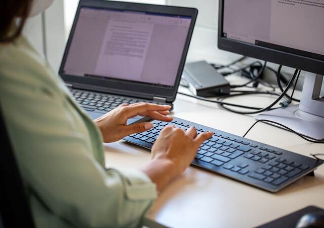 Man typing at office