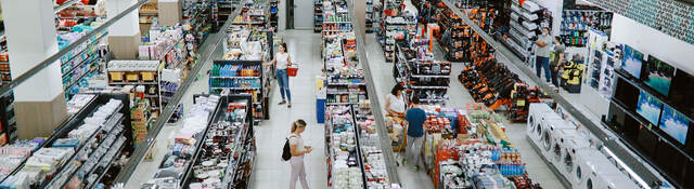 Overhead view of many people shopping in a large supermarket