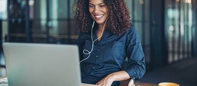 Person smiling while having an online meeting