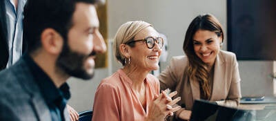 Three smiling coworkers