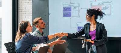 People shaking hands during a meeting