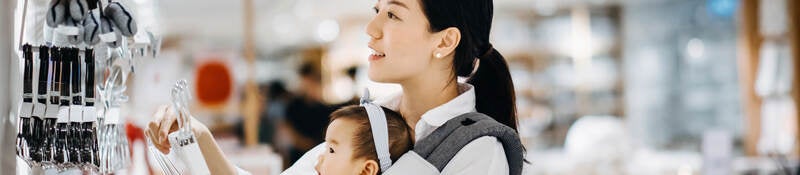 Asian women with baby shopping at department store