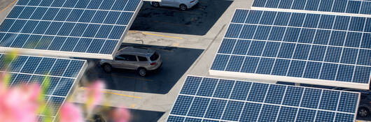 close up solar panels placed on a city public parking lot