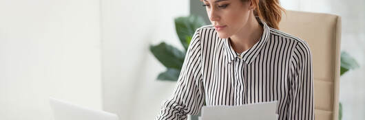 Serious businessperson working on a laptop